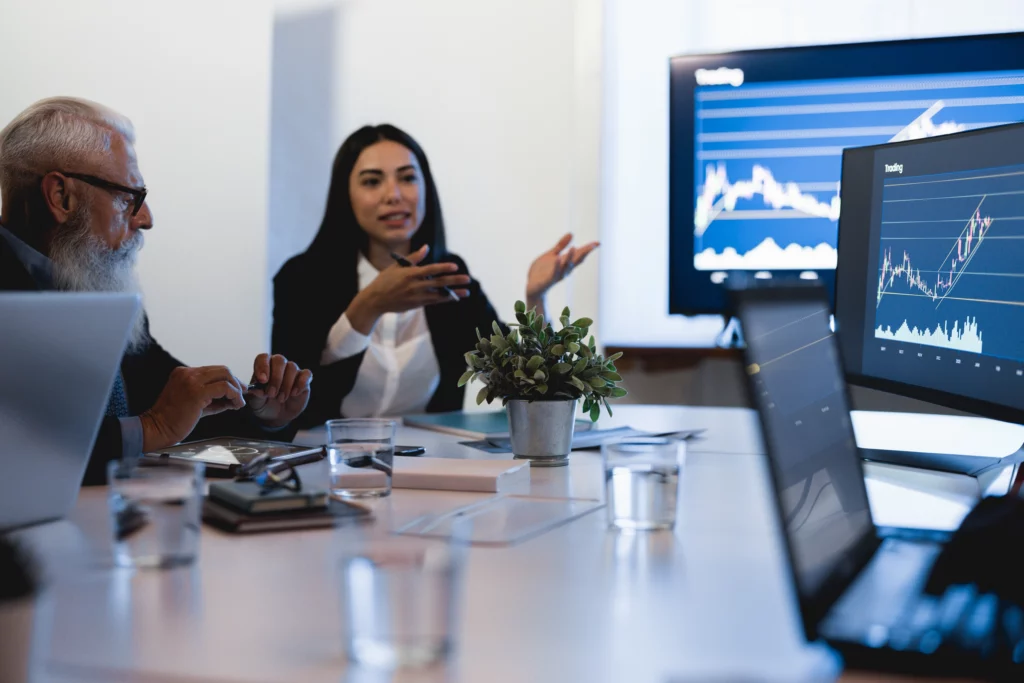 a-lady-and-a-man-discussing-trading-strategies-looking-at-trading-charts – PU Prime | More Than Trading a lady and a man discussing trading strategies looking at trading charts