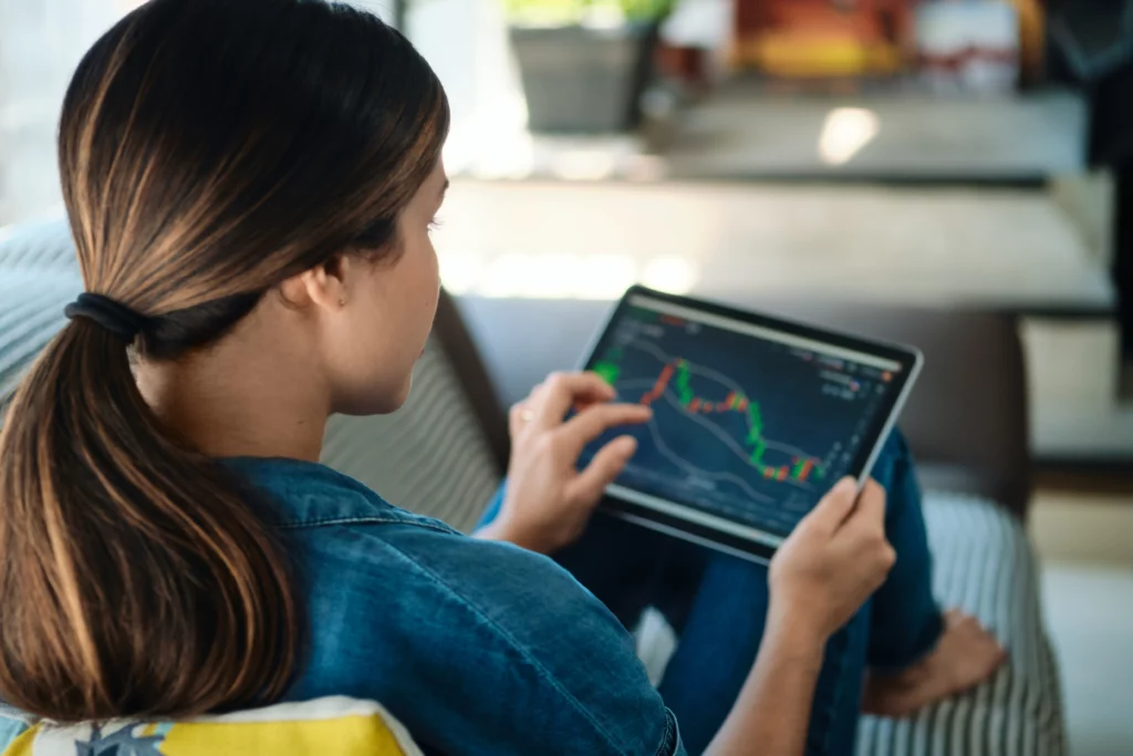 copy-trader-looking-at-trading-chart-on-a-mobile-tablet – PU Prime | More Than Trading copy trader looking at trading chart on a mobile tablet